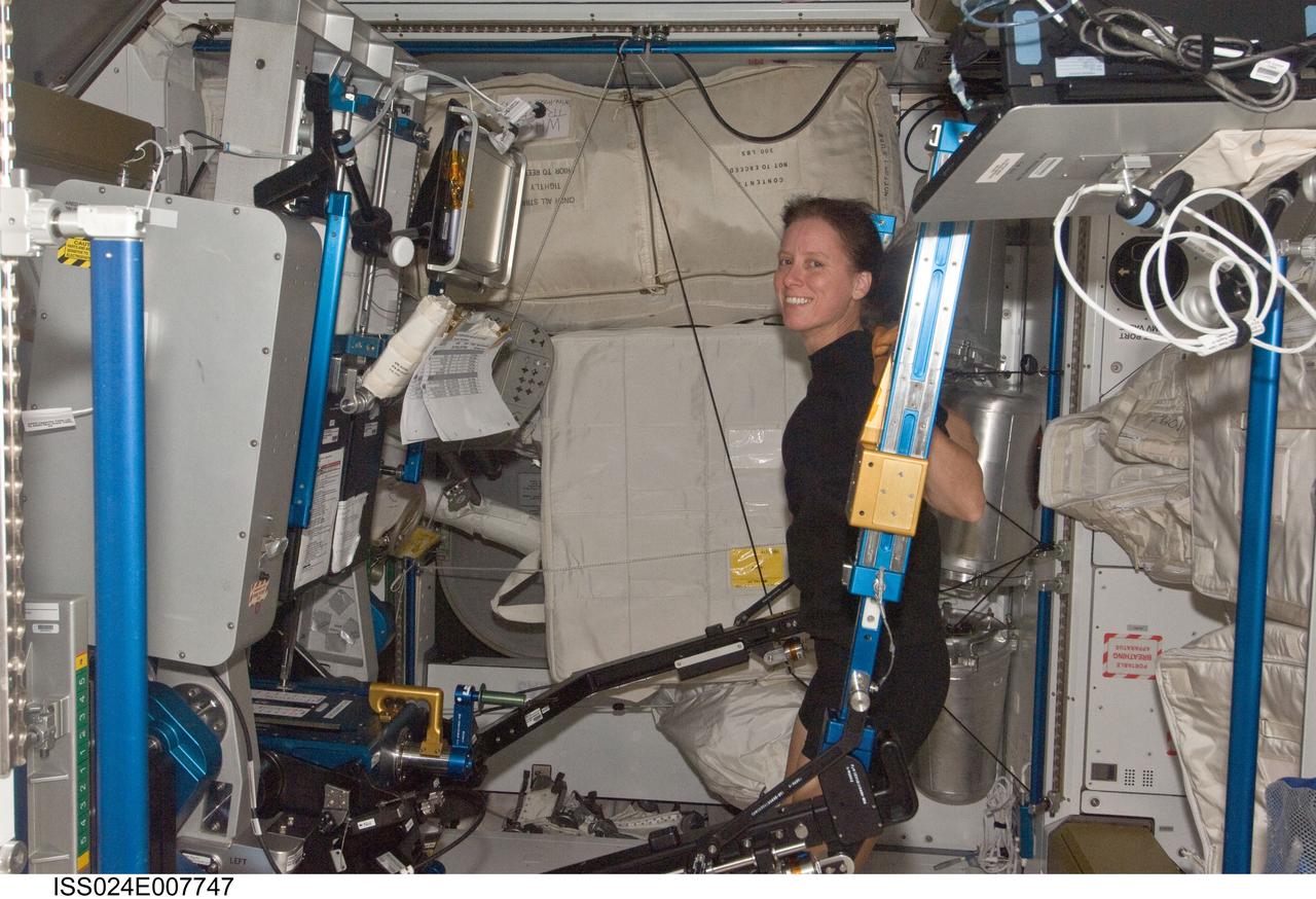 ISS024-E-007747 (11 July 2010) --- NASA astronaut Shannon Walker, Expedition 24 flight engineer, exercises using the advanced Resistive Exercise Device (aRED) in the Tranquility node of the International Space Station.