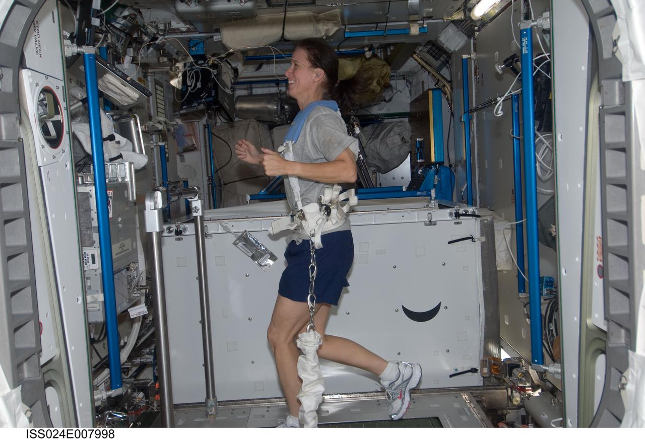 ISS024-E-007998 (12 July 2010) --- Astronaut Shannon Walker, Expedition 24 flight engineer,  exercises on the treadmill in Tranquility, also known as Node 3, on the International Space Station.