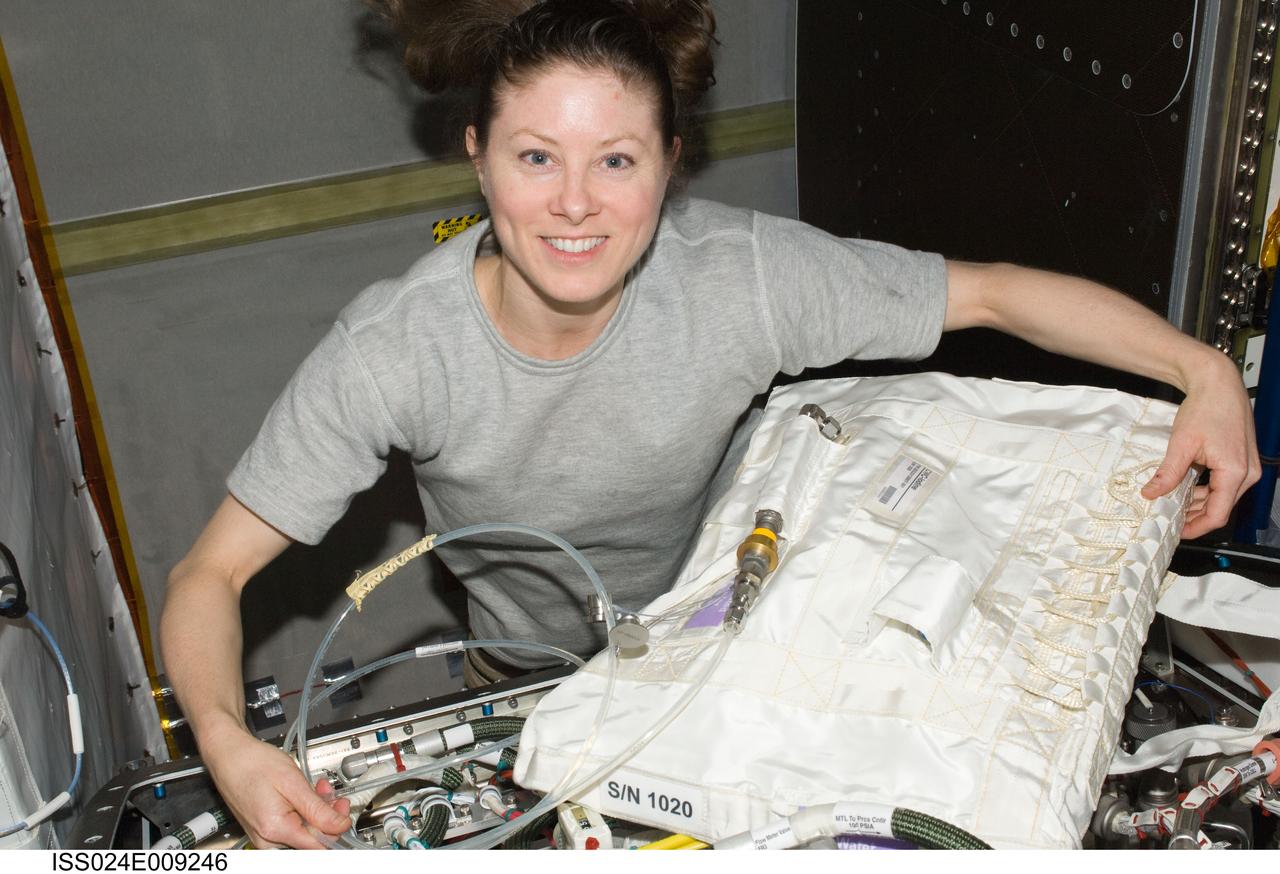 ISS024-E-009246 (21 July 2010) --- NASA astronaut Tracy Caldwell Dyson, Expedition 24 flight engineer, is pictured during troubleshooting operations of the Oxygen Generator System (OGS) hardware and replacement of an H2 (hydrogen) Dome Orbit Replaceable Unit (ORU) in the Destiny laboratory of the International Space Station.