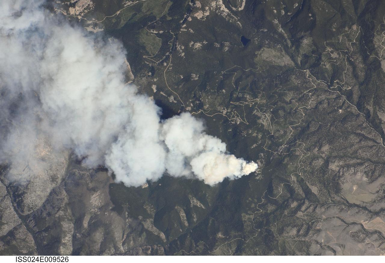 ISS024-E-009526 (25 July 2010) --- Dominic Point Fire in Montana is featured in this image photographed by an Expedition 24 crew member on the International Space Station. Lightning strikes in the forested mountains of the western United States, and human activities, can spark wild fires during the summer dry season. The Dominic Point Fire was first reported near 3:00 p.m. local time on July 25 2010. Approximately one hour later, the space station crew photographed the fire?s large smoke plume ? already extending at least eight kilometers to the east ? from orbit as they passed almost directly overhead. Forest Service fire crews, slurry bombers and helicopters were on the scene by that evening. The fire may have been started by a lightning strike, as there are no trails leading into the fire area located approximately 22 kilometers northeast of Hamilton, MT (according to local reports). As of July 26, 2010 the fire had burned approximately 283?405 hectares of the Bitterroot National Forest in western Montana. The fire is thought to have expanded quickly due to high temperatures, low humidity, and favorable winds with an abundance of deadfall ? dead trees and logs that provide readily combustible fuels ? in the area.