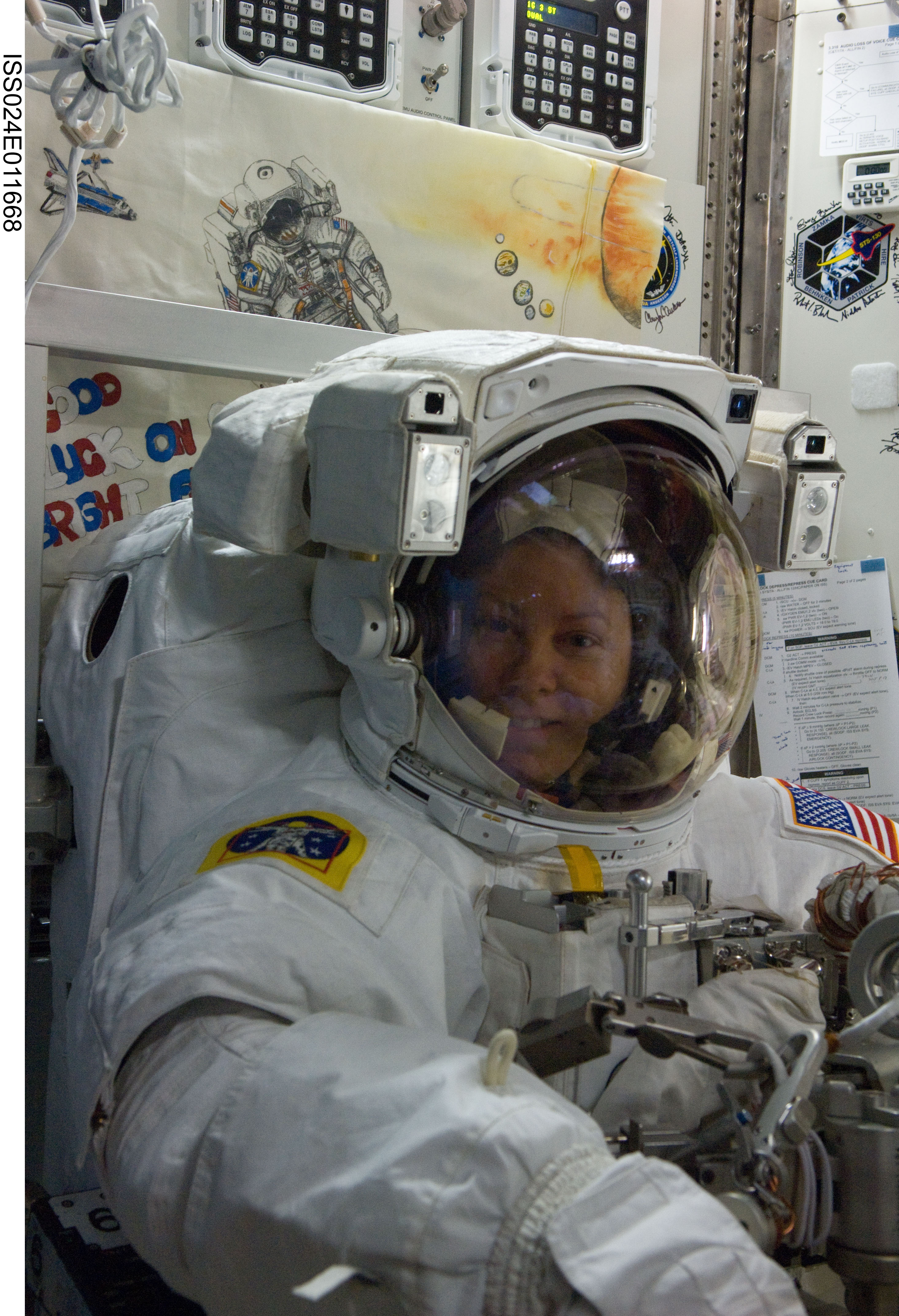 ISS024-E-011668 (11 Aug. 2010) --- NASA astronaut Tracy Caldwell Dyson, Expedition 24 flight engineer, attired in her Extravehicular Mobility Unit (EMU) spacesuit, is pictured in the Quest airlock of the International Space Station during preparations for the second of three planned spacewalks to remove and replace an ammonia pump module that failed July 31.
