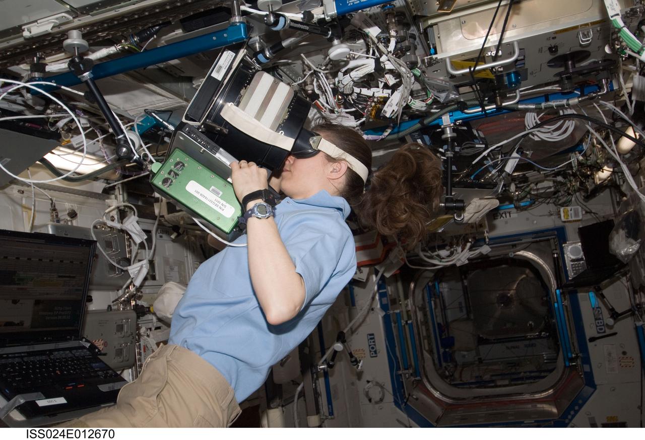 ISS024-E-012670 (30 Aug. 2010) --- NASA astronaut Tracy Caldwell Dyson, Expedition 24 flight engineer, uses Neurospat hardware to perform the Bodies in the Space Environment (BISE) experiment in the Destiny laboratory of the International Space Station. The Canadian Space Agency-sponsored BISE experiment studies how astronauts perceive up and down in microgravity.