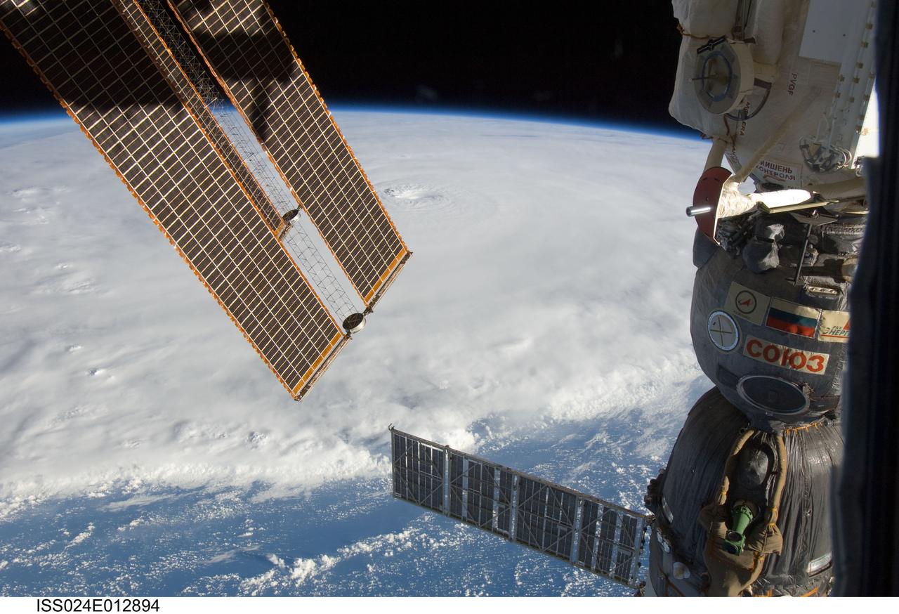 ISS024-E-012894 (30 Aug. 2010) --? Photographed by an Expedition 24 crew member on the International Space Station, this is an oblique view that shows the eye (just above center) of Hurricane Earl (at this time a category 4 but later downgraded to a category 3), centered just north of the Virgin Islands near 19.3 north latitude and 64.7 west longitude packing 115-kilometer winds. A Russian Soyuz vehicle is docked to the station (foreground). The photo was taken with a digital still camera using a 22mm lens.