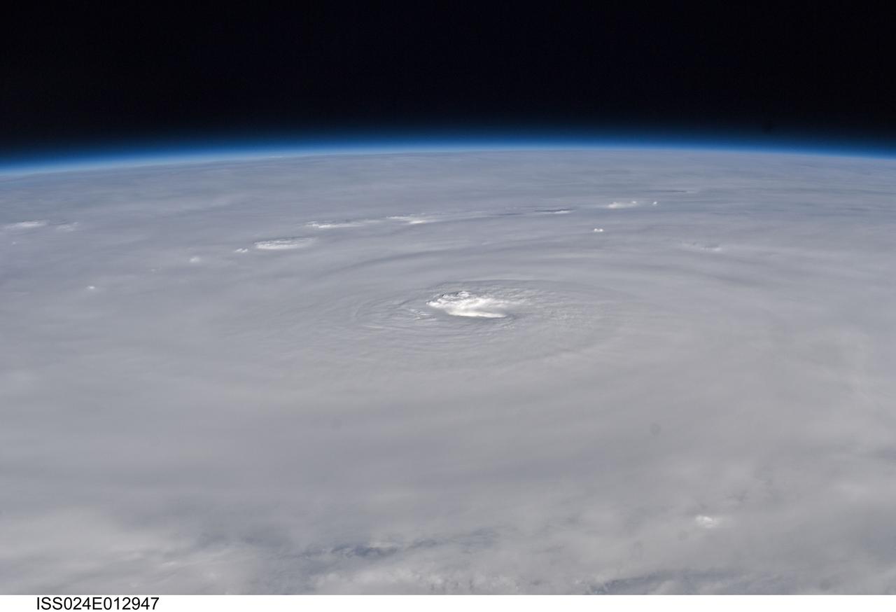 ISS024-E-012947 (30 Aug. 2010) --– Photographed by an Expedition 24 crew member on the International Space Station, this is an oblique view of the eye (center) of Hurricane Earl (at this time a category 4 but later downgraded to a category 3), centered just north of the Virgin Islands near 19.3 north latitude and 64.7 west longitude packing 115-kilometer winds. The photo was taken with a digital still camera using a 50mm lens.