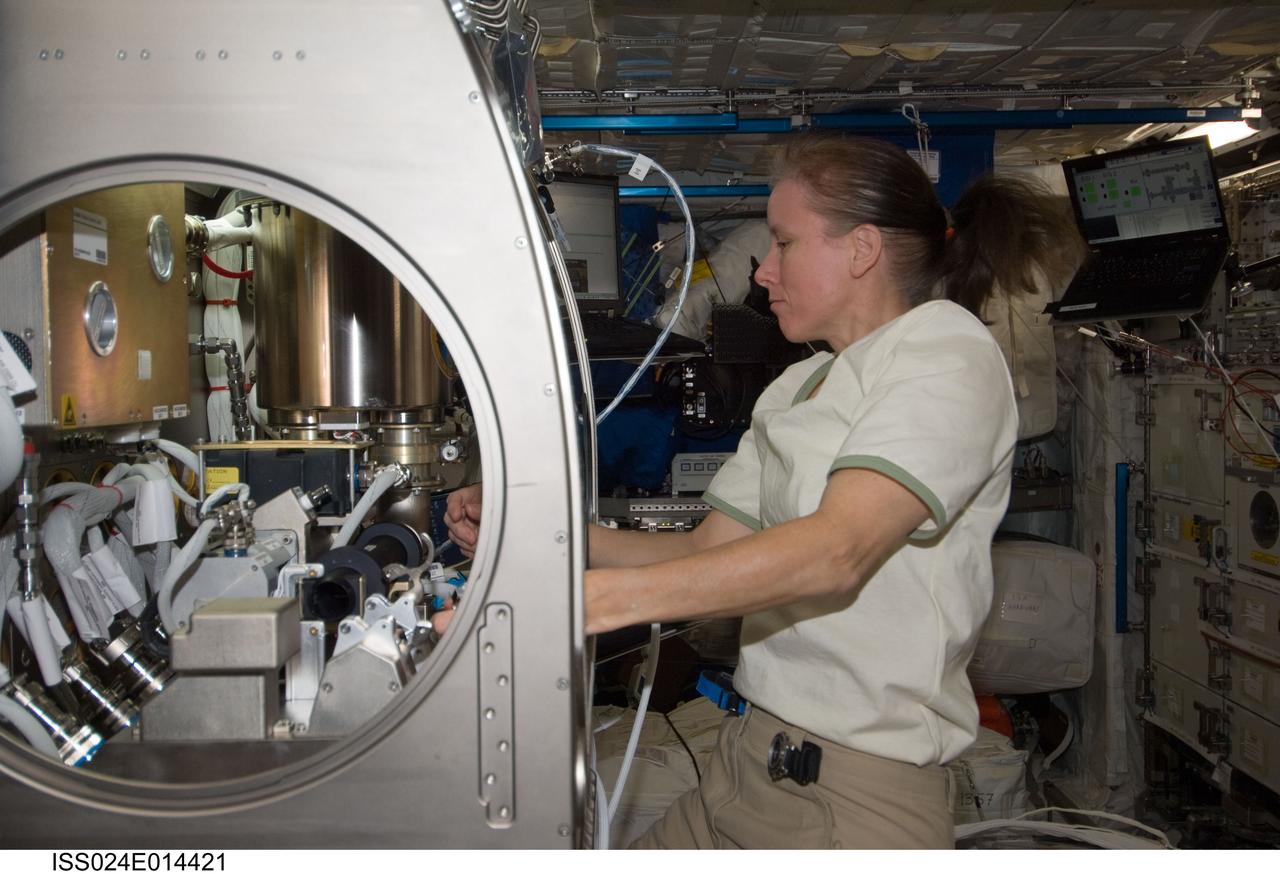 ISS024-E-014421 (13 Sept. 2010) --- NASA astronaut Shannon Walker, Expedition 24 flight engineer, works on the COLLOID experiment inside the Microgravity Science Glovebox (MSG) in the Columbus laboratory of the International Space Station.