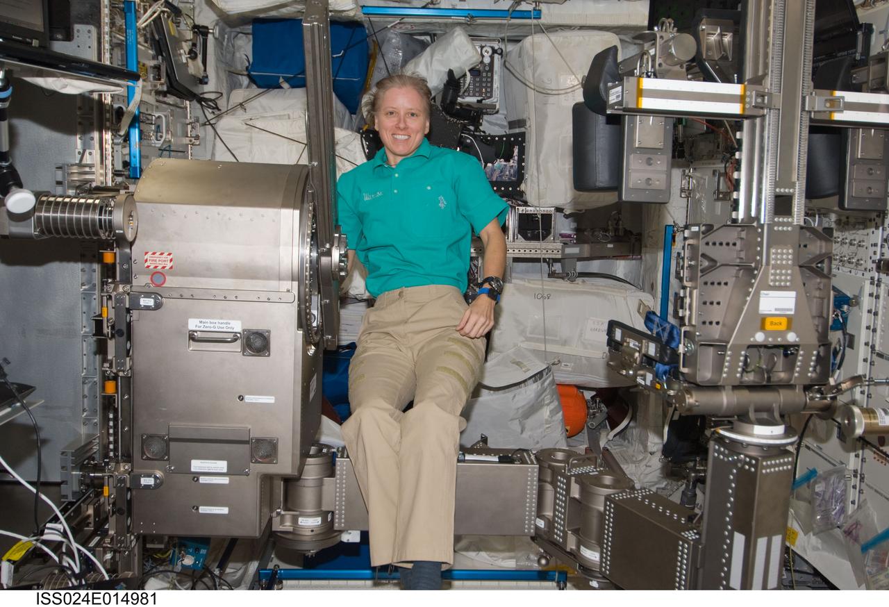 ISS024-E-014981 (17 Sept. 2010) --- NASA astronaut Shannon Walker, Expedition 24 flight engineer, works with Muscle Atrophy Resistive Exercise System (MARES) hardware during installation of MARES payload in the Columbus laboratory of the International Space Station.