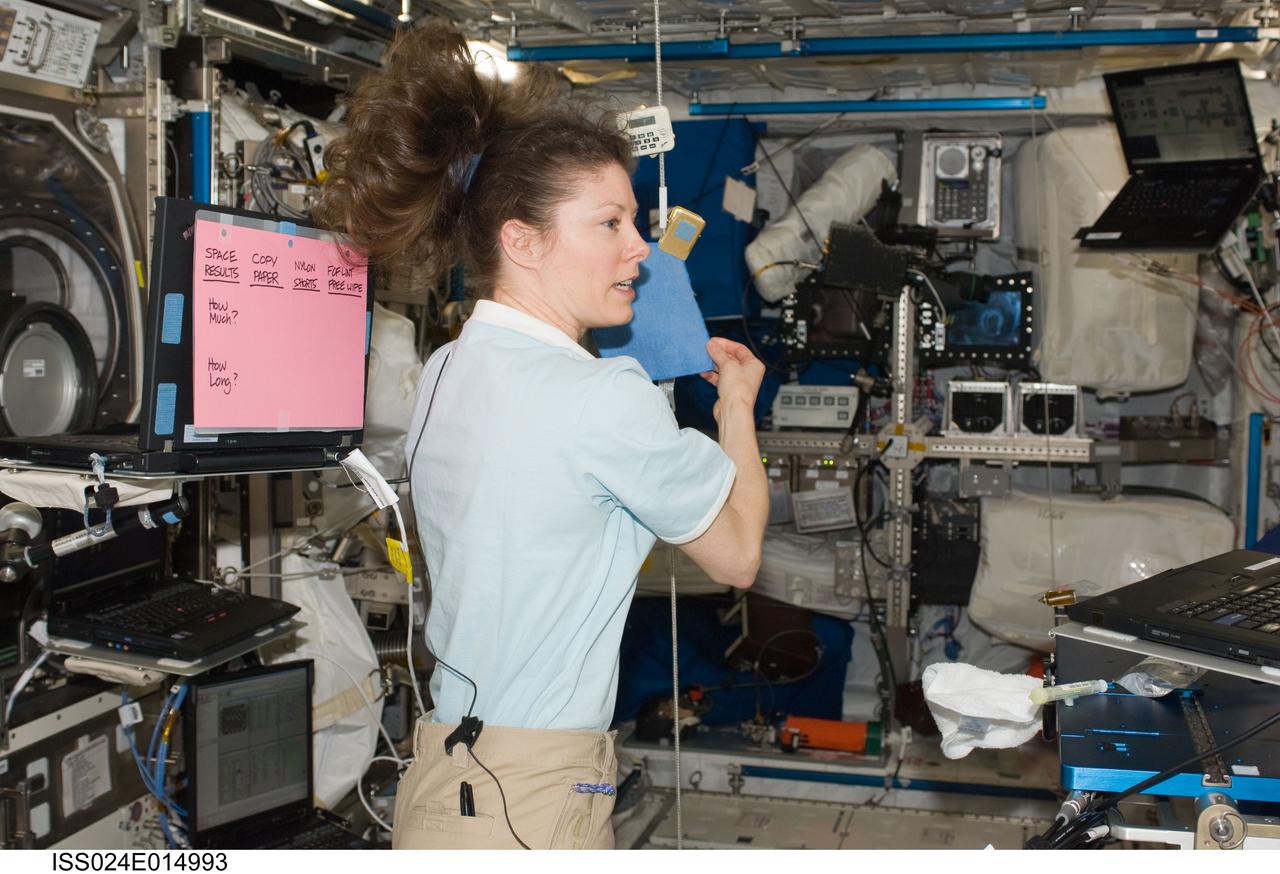 ISS024-E-014993 (15 Sept. 2010) --- NASA astronaut Tracy Caldwell Dyson, Expedition 24 flight engineer, conducts a demonstration for the "Kids in Space" session for Water Absorption Flight Procedures #40 in the Columbus laboratory of the International Space Station.