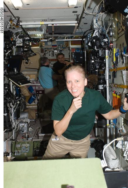 NASA image: Expedition 24 Crew Members working in the SM