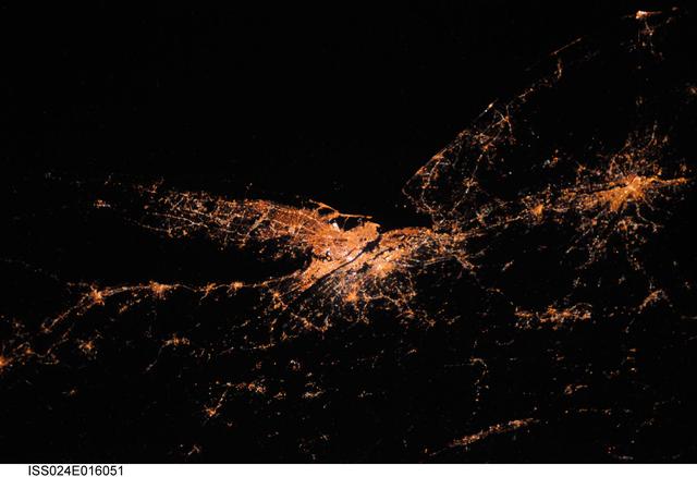 ISS024-E-016051 (27 Aug. 2010) --- This night time view captured by one of the Expedition 24 crew members aboard the International Space Station some 220 miles above Earth is looking down upon New York City. The actual nadir estimate is 39.1 degrees north latitude and 71.2 degrees west longitude or about 170 miles southeast of the city over the Atlantic. Philadelphia is also visible to the right. Long Island and the Connecticut coastal cities mark Long Island Sound. Atlantic City is that small bright spot in the upper right corner. The image was exposed in August and was physically brought back to Earth on a disk with the return of the Expedition 25 crew in November 2010.