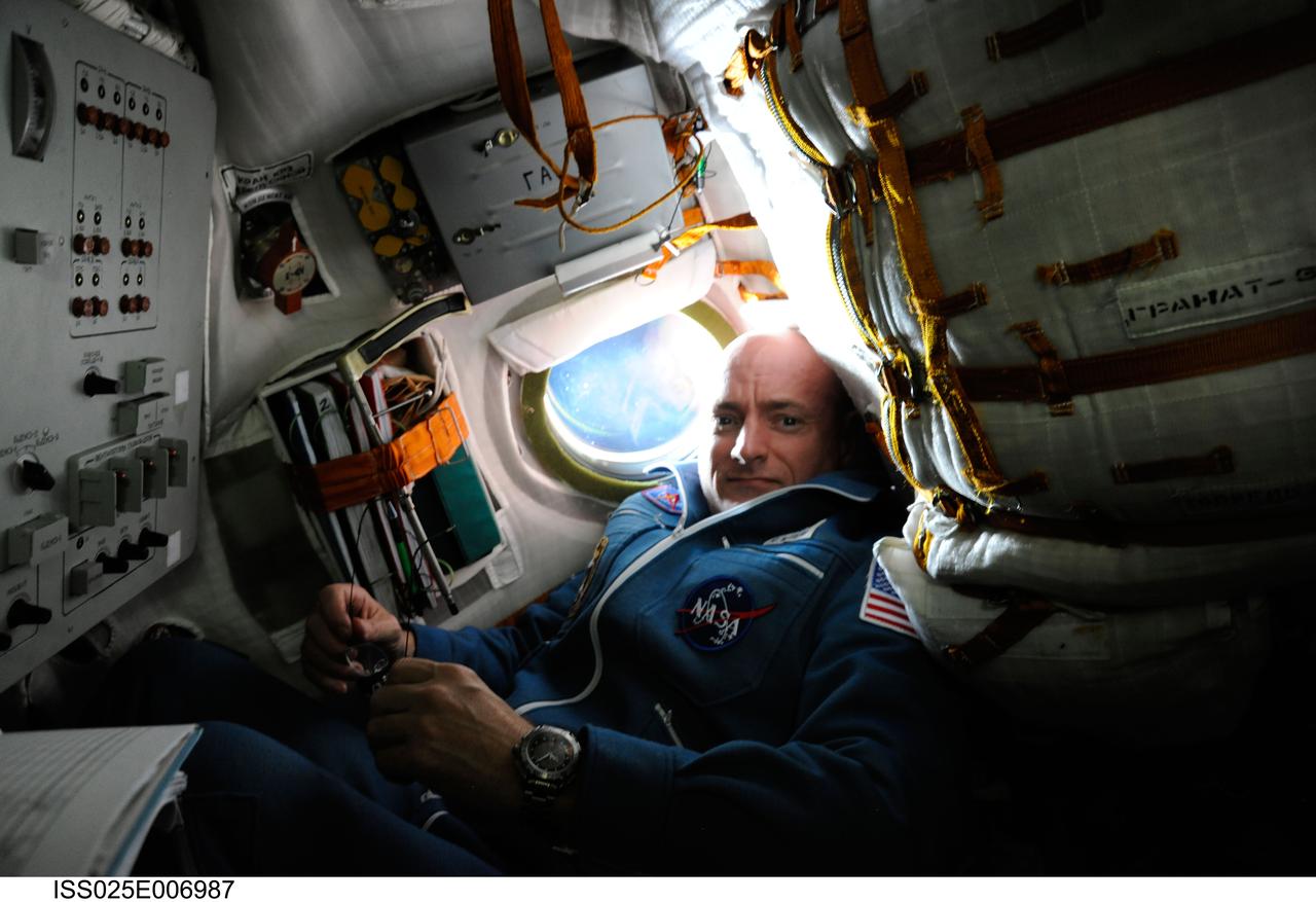 ISS025-E-006987 (9 Oct. 2010) ---NASA astronaut Scott Kelly, Expedition 25 flight engineer, is pictured inside the Soyuz TMA-01M  spacecraft on docking day with the International Space Station.