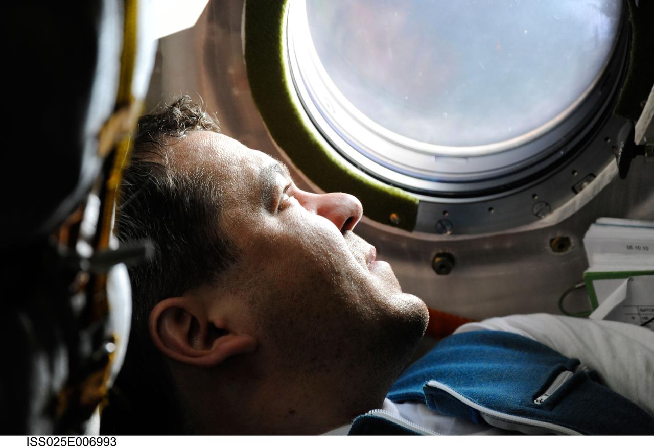 ISS025-E-006993 (9 Oct. 2010) --- Russian cosmonaut Oleg Skripochka, Expedition 25 flight engineer, is pictured inside the Soyuz TMA-01M spacecraft on docking day with the International Space Station.