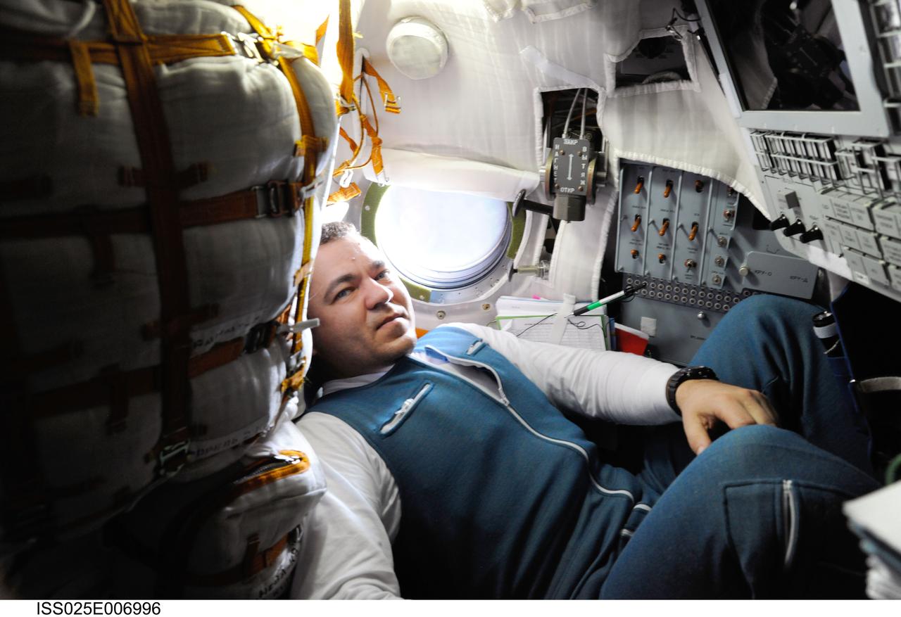 ISS025-E-006996 (9 Oct. 2010) --- Russian cosmonaut Oleg Skripochka, Expedition 25 flight engineer, is pictured inside the Soyuz TMA-01M spacecraft on docking day with the International Space Station.