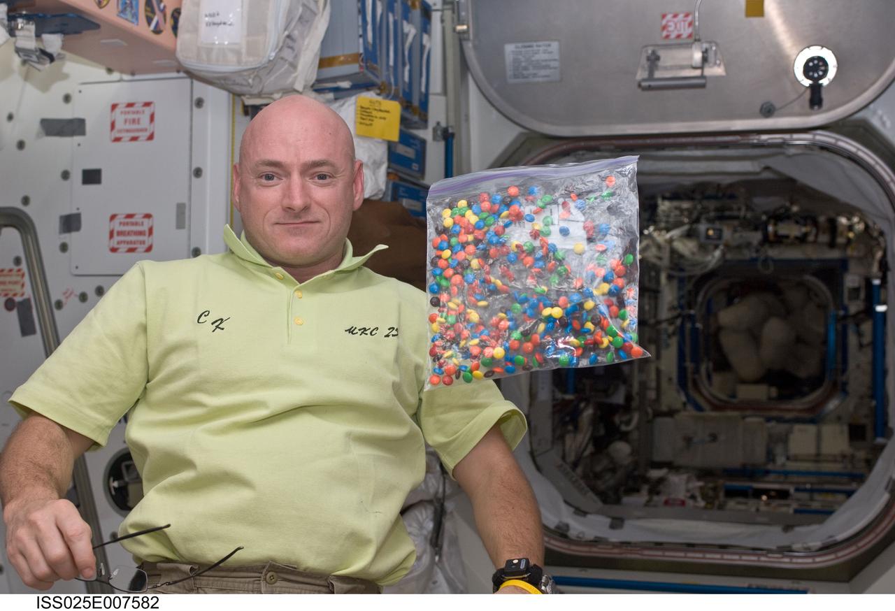 ISS025-E-007582 (17 Oct. 2010) --- NASA astronaut Scott Kelly, Expedition 25 flight engineer, is pictured with a bag of candy floating freely in the Unity node of the International Space Station.