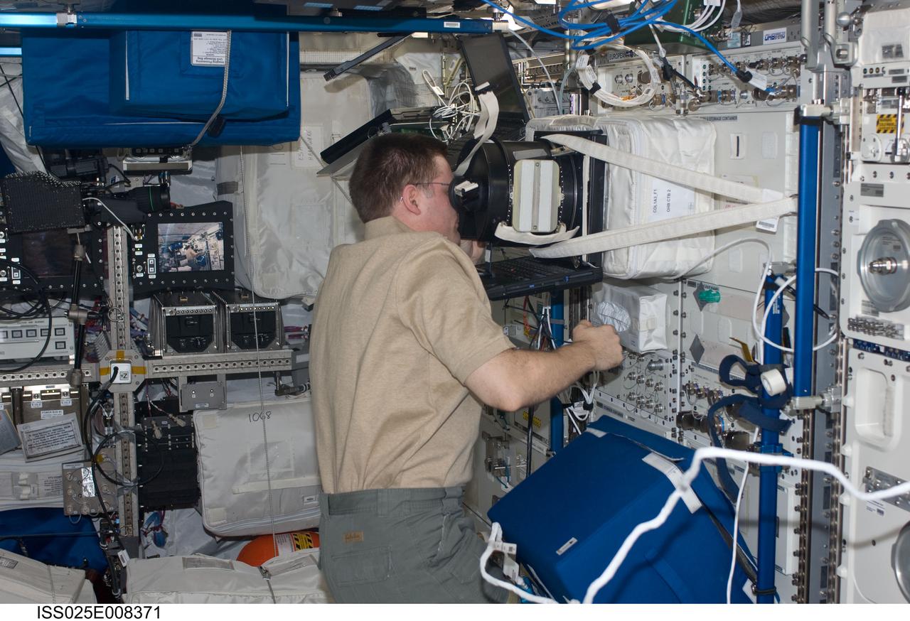 ISS025-E-008371 (20 Oct. 2010) --- NASA astronaut Doug Wheelock, Expedition 25 commander, uses Neurospat hardware to perform a science session with the European Space Agency PASSAGES experiment in the Columbus laboratory of the International Space Station. PASSAGES is designed to test how astronauts interpret visual information in weightlessness. It aims at studying the effects of microgravity on the use of the ‘Eye-Height’ strategy for estimating allowed actions in an environment, and whether this could possibly decrease after a long exposure to weightlessness.