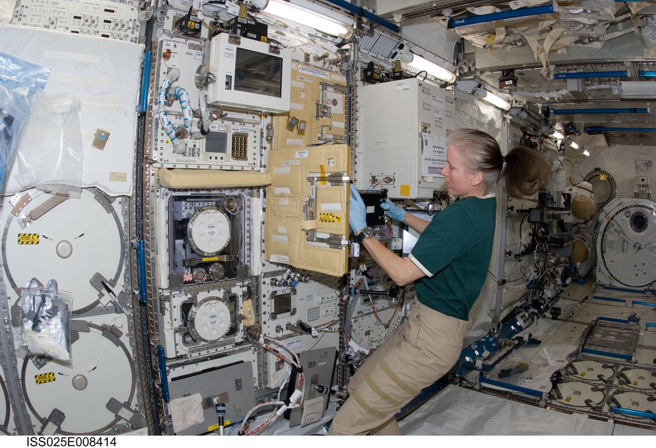 ISS025-E-008414 (21 Oct. 2010) --- NASA astronaut Shannon Walker, Expedition 25 flight engineer, works at the Cell Biology Experiment Facility (CBEF) in the Kibo laboratory of the International Space Station.