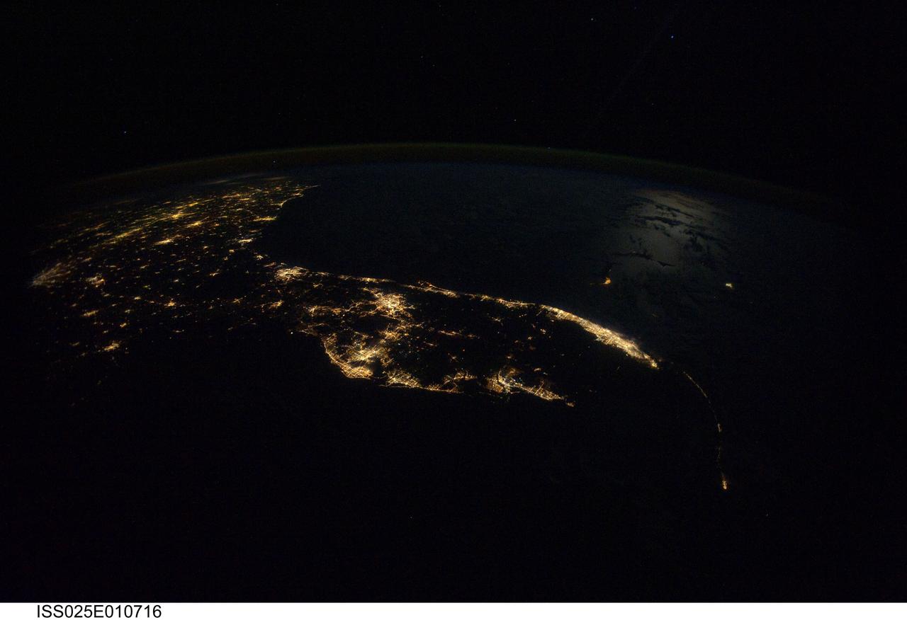 ISS025-E-010716 (31 Oct. 2010) --- From 220 miles above Earth, one of the Expedition 25 crew members aboard the International Space Station exposed this night time image of the Florida peninsula on Oct. 31. Both the Gulf and Atlantic coasts are clearly visible in the scene, which includes the Florida "Panhandle" and part of the Georgia coast.