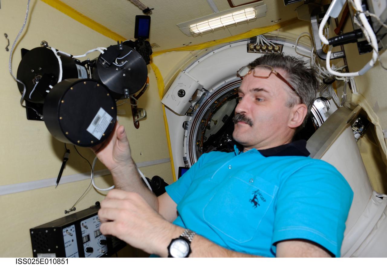 ISS025-E-010851 (3 Nov. 2010) --- Russian cosmonaut Alexander Kaleri, Expedition 25 flight engineer, works on the newly installed Russian experiment KPT-10 "Kulonovskiy Kristall" (Coulomb Crystal), assembling the payload equipment and initiating operation, in a Russian module on the International Space Station.