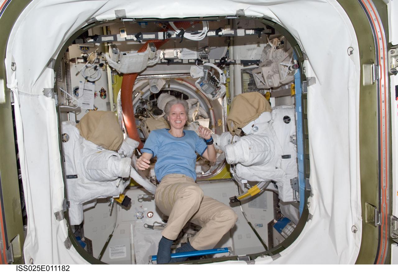 ISS025-E-011182 (3 Nov. 2010) --- NASA astronaut Shannon Walker, Expedition 25 flight engineer, is pictured in the Quest airlock of the International Space Station.