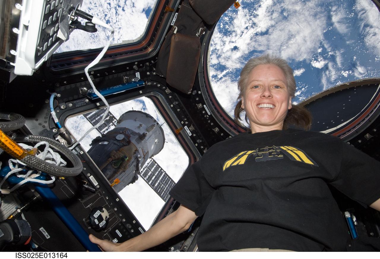 ISS025-E-013164 (7 Nov. 2010) --- NASA astronaut Shannon Walker, Expedition 25 flight engineer, is pictured near the windows in the Cupola of the International Space Station.