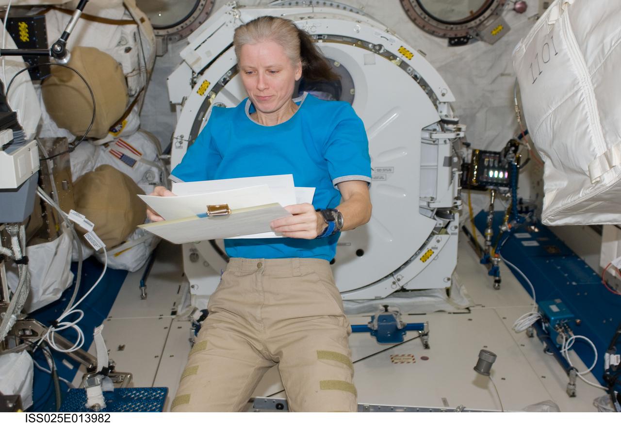 ISS025-E-013982 (11 Nov. 2010) --- NASA astronaut Shannon Walker, Expedition 25 flight engineer, reads a checklist while working in the Kibo laboratory of the International Space Station.