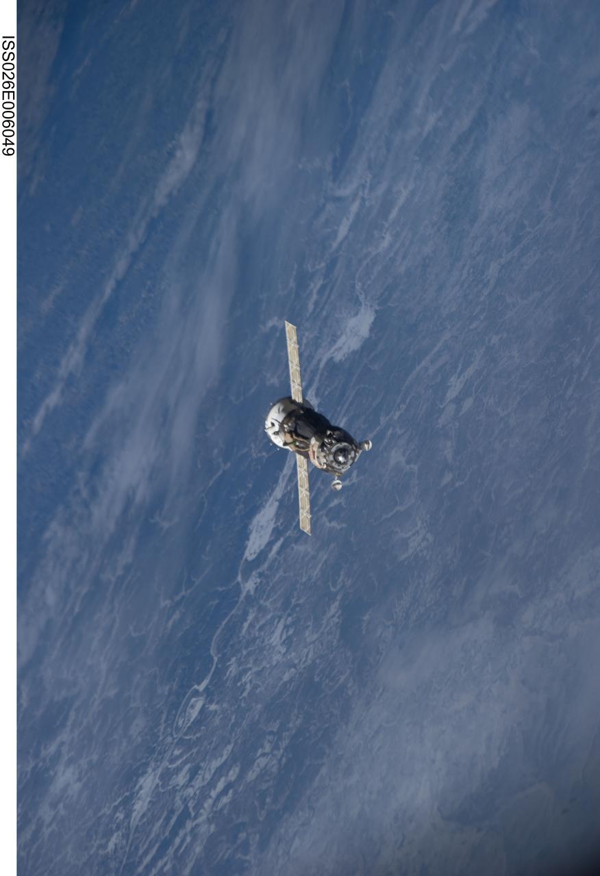 ISS026-E-006049 (25 Nov. 2010) --- The Soyuz TMA-19 spacecraft departs the International Space Station on Nov. 25, 2010. Onboard are three members of Expedition 25 – NASA astronaut Doug Wheelock, commander; along with NASA astronaut Shannon Walker and Russian cosmonaut Fyodor Yurchikhin, both flight engineers. Yurchikhin, the Soyuz commander, was at the controls of the spacecraft as it undocked at 8:23 p.m. (EST) from the station's Rassvet module.