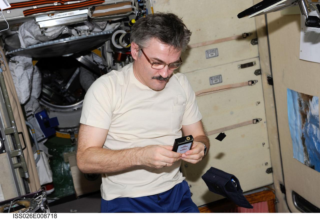 ISS026-E-008718 (8 Dec. 2010) --- Russian cosmonaut Alexander Kaleri, Expedition 26 flight engineer, sets up the Russian MBI-12 payload for a Sonokard experiment session in the Zvezda Service Module of the International Space Station. Kaleri used a sports shirt from the Sonokard kit with a special device in the pocket for testing a new method for acquiring physiological data without using direct contact on the skin. Measurements are recorded on a data card for return to Earth.