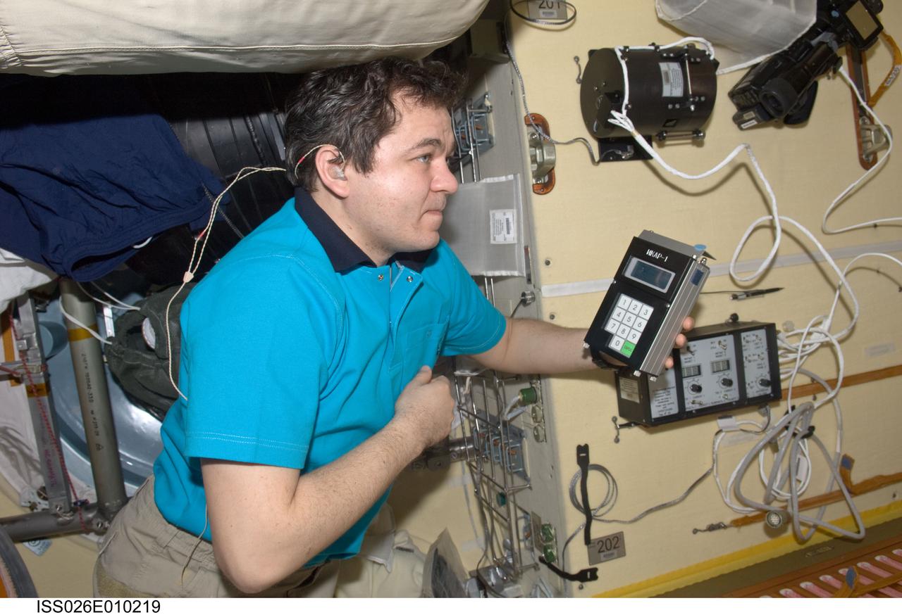 ISS026-E-010219 (14 Dec. 2010) --- Russian cosmonaut Oleg Skripochka, Expedition 26 flight engineer, uses the Russian Tekh-38 VETEROK (“Breeze”) science hardware to take aero-ionic concentration measurements in the Rassvet Mini-Research Module 1 (MRM1) of the International Space Station.