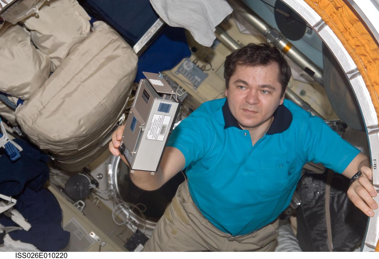 ISS026-E-010220 (14 Dec. 2010) --- Russian cosmonaut Oleg Skripochka, Expedition 26 flight engineer, uses the Russian Tekh-38 VETEROK (“Breeze”) science hardware to take aero-ionic concentration measurements in the Rassvet Mini-Research Module 1 (MRM1) of the International Space Station.