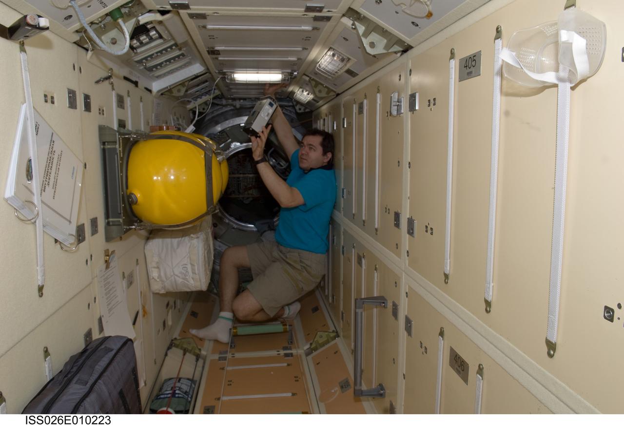 ISS026-E-010223 (14 Dec. 2010) --- Russian cosmonaut Oleg Skripochka, Expedition 26 flight engineer, uses the Russian Tekh-38 VETEROK (“Breeze”) science hardware to take aero-ionic concentration measurements in the Rassvet Mini-Research Module 1 (MRM1) of the International Space Station.