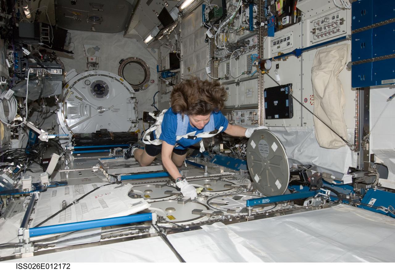 ISS026-E-012172 (26 Dec. 2010) --- NASA astronaut Catherine (Cady) Coleman, Expedition 26 flight engineer, services the Minus Eighty Laboratory Freezer for ISS (MELFI-1) in the Kibo laboratory of the International Space Station.