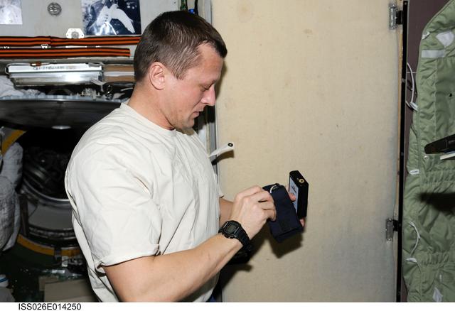 NASA image: Kondratvez sets up Sonokard Experiment in the SM during Expedition 26