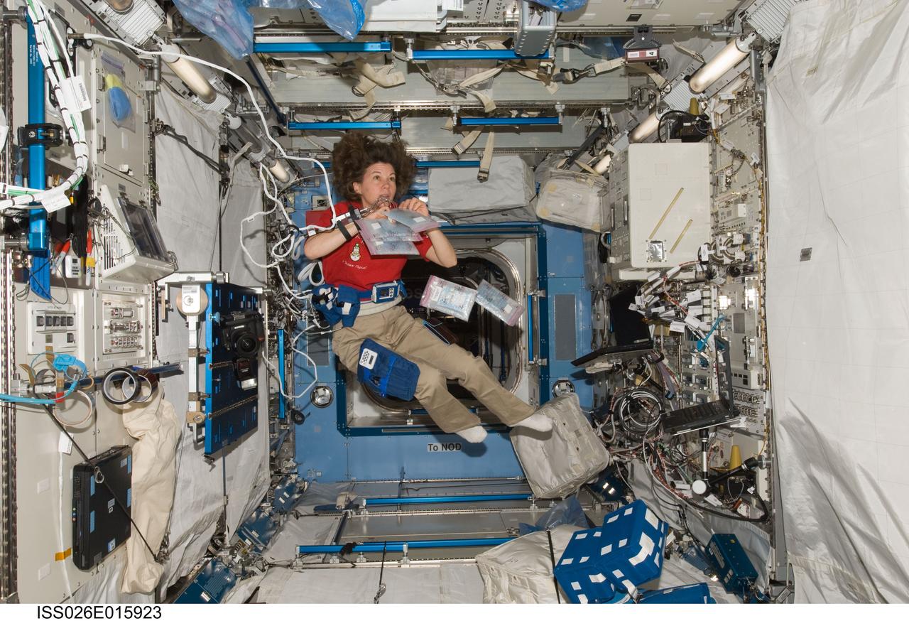 ISS026-E-015923 (7 Jan. 2011) --- NASA astronaut Catherine (Cady) Coleman, Expedition 26 flight engineer, participates in the ambulatory monitoring part of the Integrated Cardiovascular (ICV) assessment research experiment in the Kibo laboratory of the International Space Station. Coleman is wearing electrodes, a Holter Monitor 2 (HM2) for recording Electrocardiogram (ECG), a European Space Agency (ESA) Cardio pressure / Blood Pressure unit to continuously monitor blood pressure and two Actiwatches (hip/waist and ankle) for monitoring activity levels.