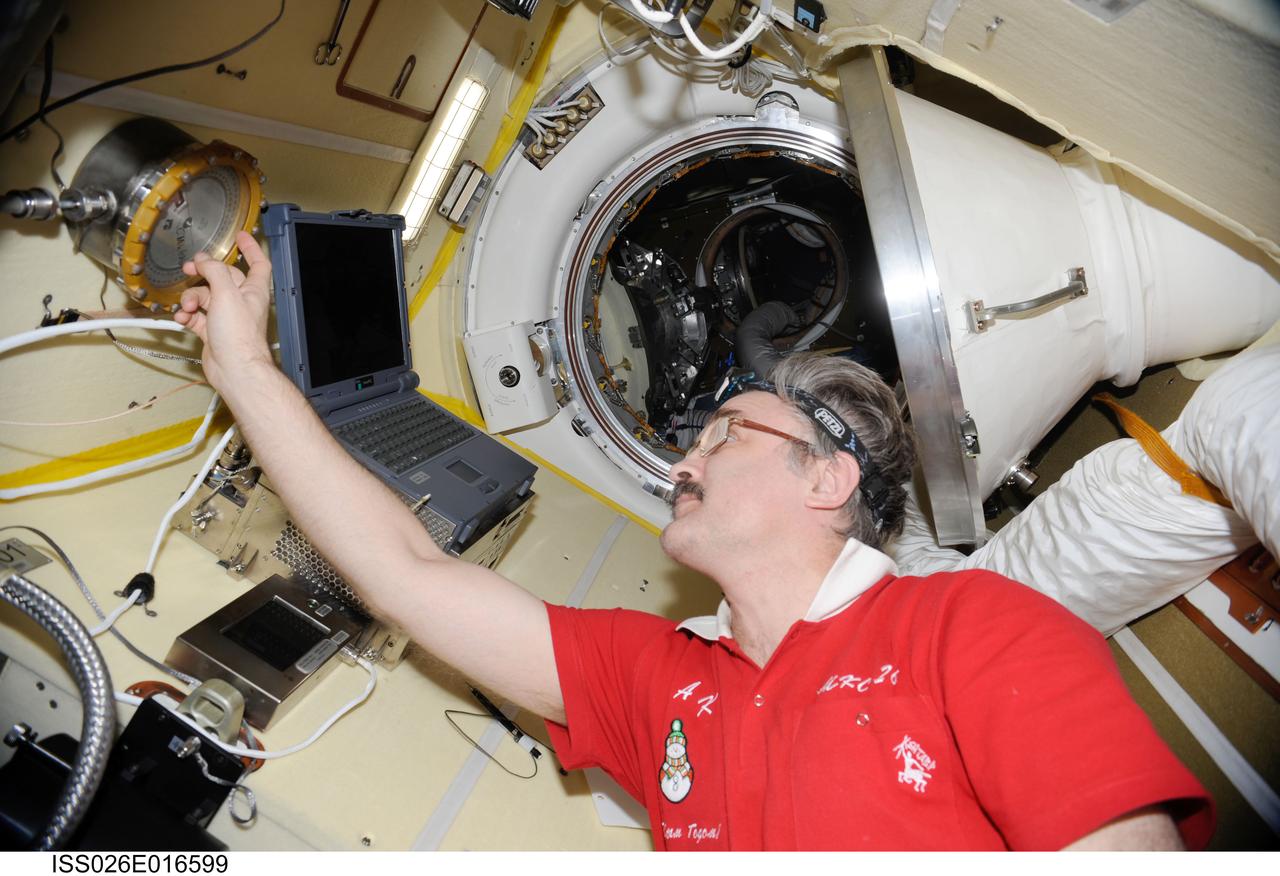 ISS026-E-016599 (10 Jan. 2011) --- Russian cosmonaut Alexander Kaleri, Expedition 26 flight engineer, works in the Poisk Mini-Research Module 2 (MRM2) of the International Space Station.