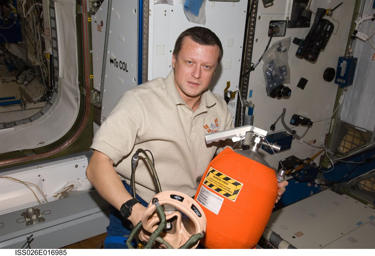 ISS026-E-016985 (11 Jan. 2011) --- Russian cosmonaut Dmitry Kondratyev, Expedition 26 flight engineer, participates in an emergency scenarios drill in the Harmony node of the International Space Station.