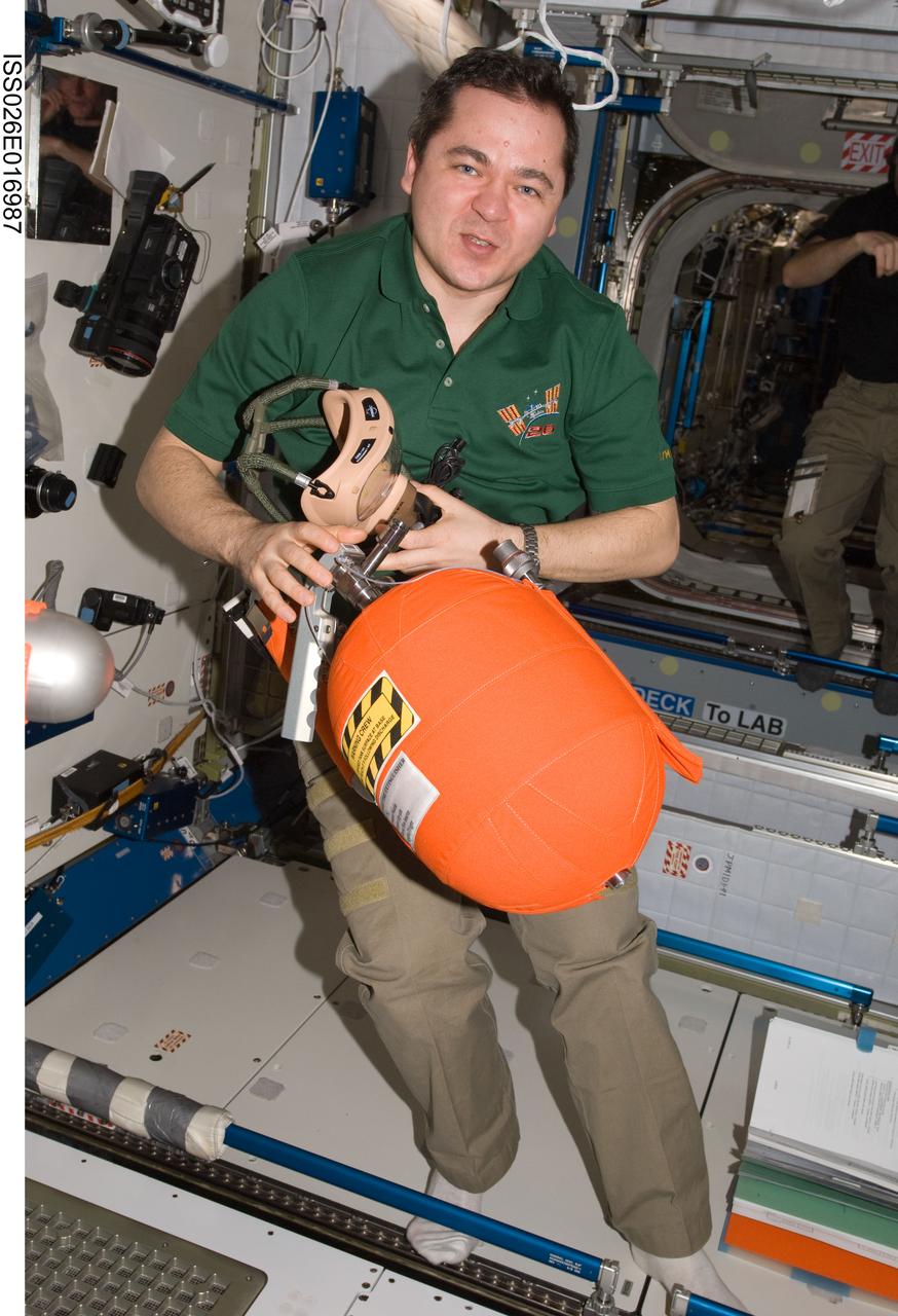 ISS026-E-016987 (11 Jan. 2011) --- Russian cosmonaut Oleg Skripochka, Expedition 26 flight engineer, participates in an emergency scenarios drill in the Harmony node of the International Space Station.