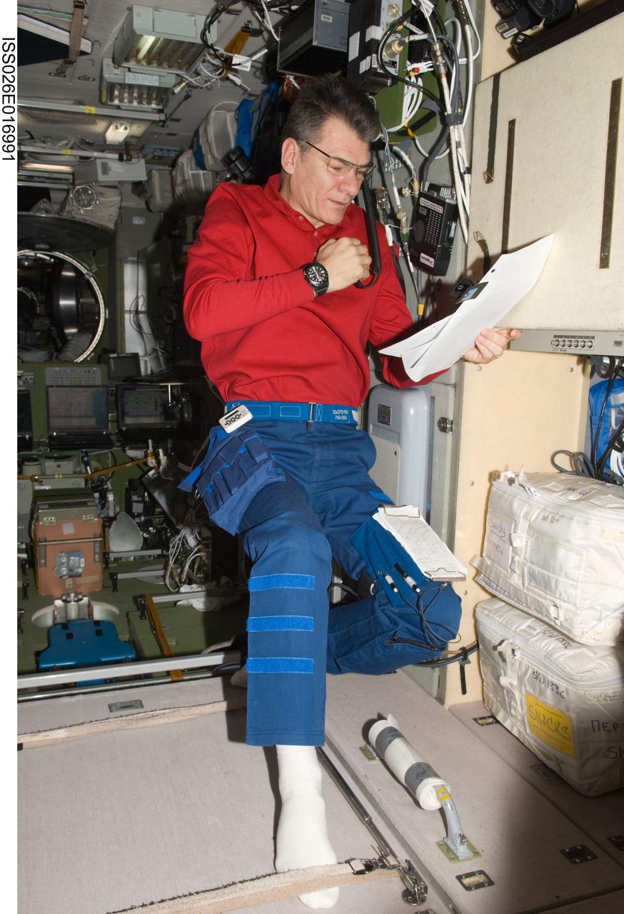 ISS026-E-016991 (8 Jan. 2011) --- European Space Agency astronaut Paolo Nespoli, Expedition 26 flight engineer, conducts a ham radio session from the Zvezda Service Module of the International Space Station with students at Universit? degli studi di Bari ?Cittadella Mediterranea della Scienza,? Bari, Italy.