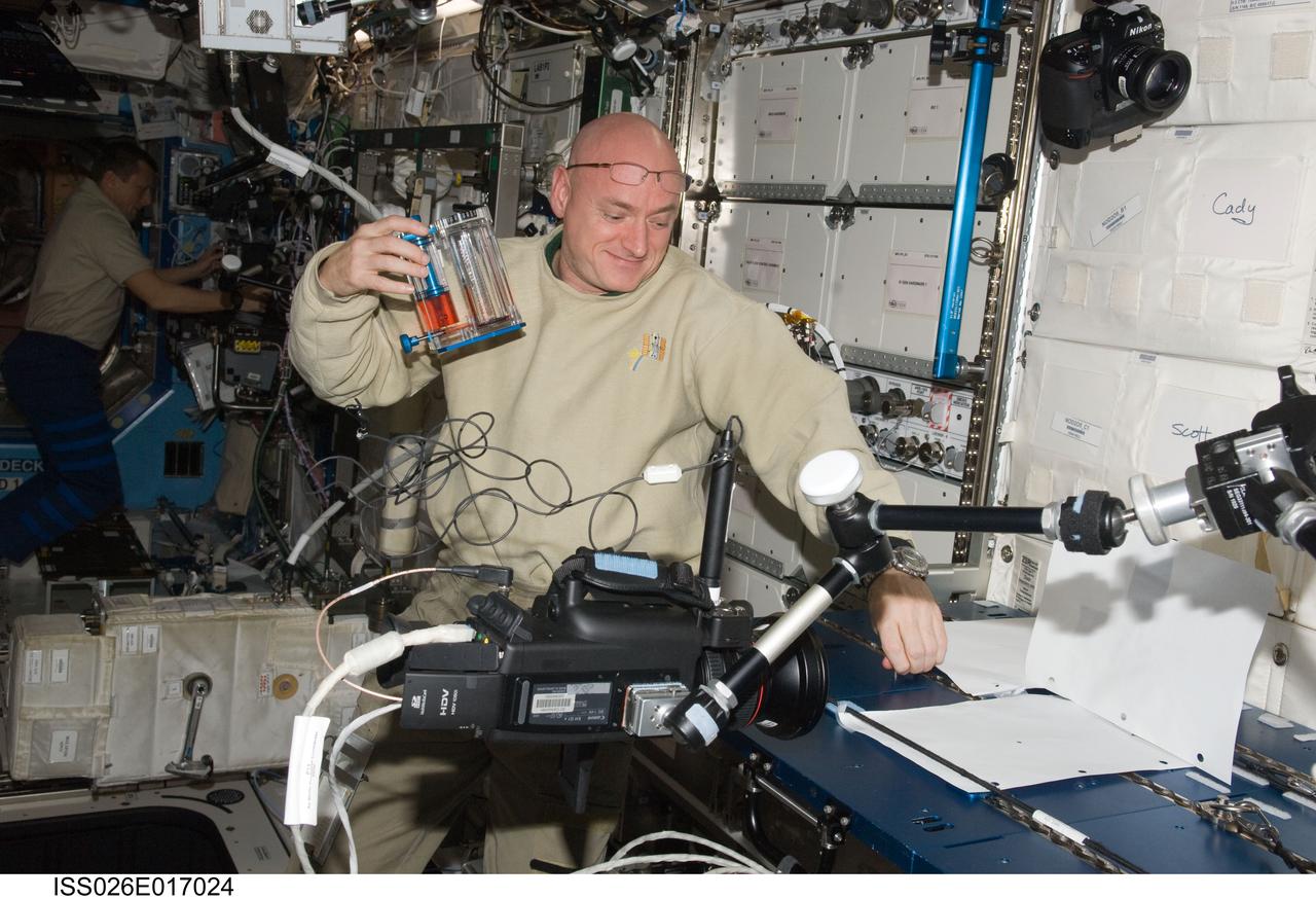 ISS026-E-017024 (11 Jan. 2011) --- NASA astronaut Scott Kelly, Expedition 26 commander, works on the hardware setup for a Capillary Flow Experiment (CFE) Vane Gap-1 experiment. The CFE is positioned on the Maintenance Work Area in the Destiny laboratory of the International Space Station. CFE observes the flow of fluid, in particular capillary phenomena, in microgravity.