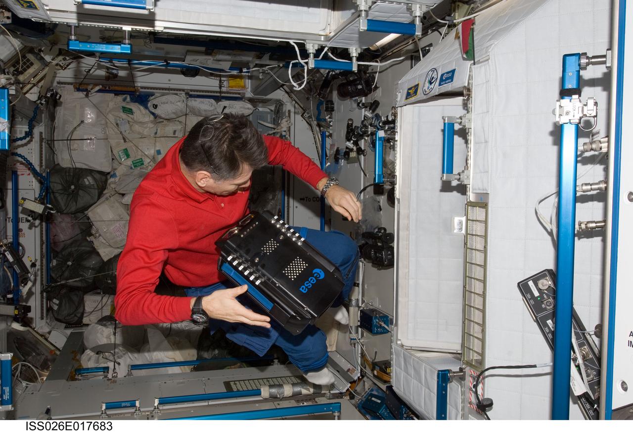 ISS026-E-017683 (8 Jan. 2011) --- European Space Agency astronaut Paolo Nespoli, Expedition 26 flight engineer, works with European Recording Binocular (ERB2) hardware in the Harmony node of the International Space Station.