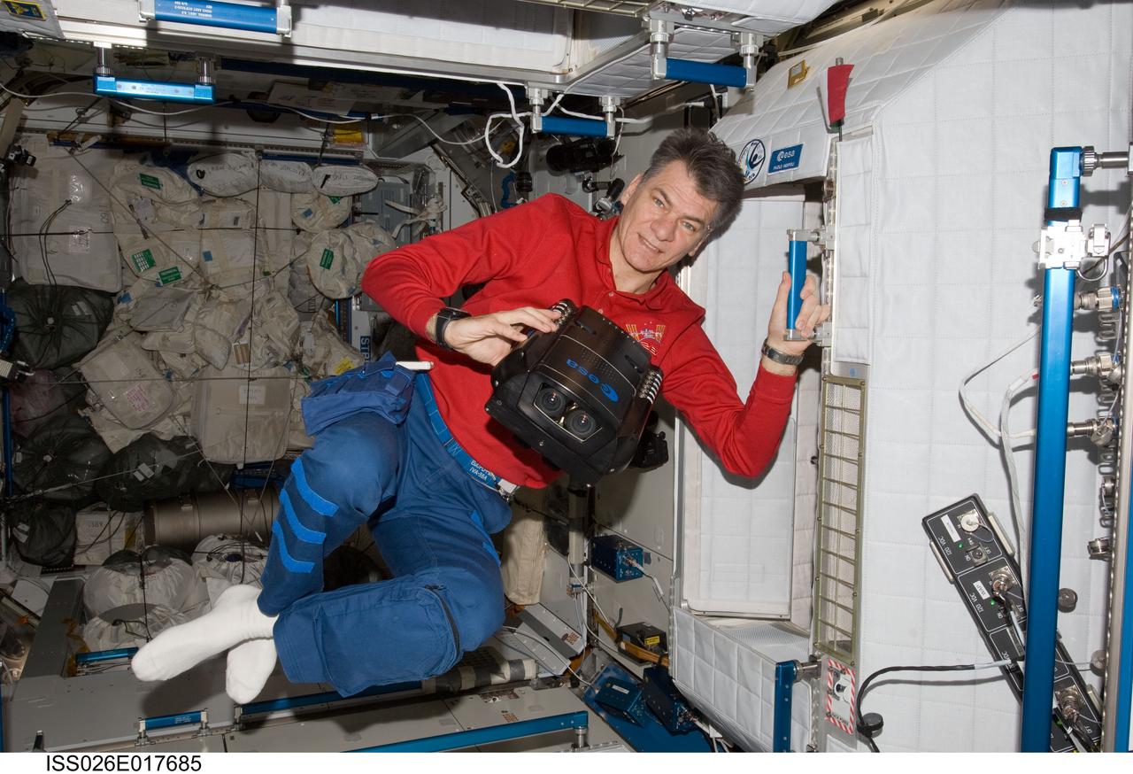 ISS026-E-017685 (8 Jan. 2011) --- European Space Agency astronaut Paolo Nespoli, Expedition 26 flight engineer, works with European Recording Binocular (ERB2) hardware in the Harmony node of the International Space Station.