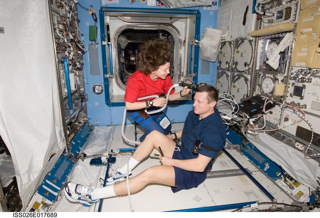NASA image: Coleman cuts Kondratyev's hair in the JPM