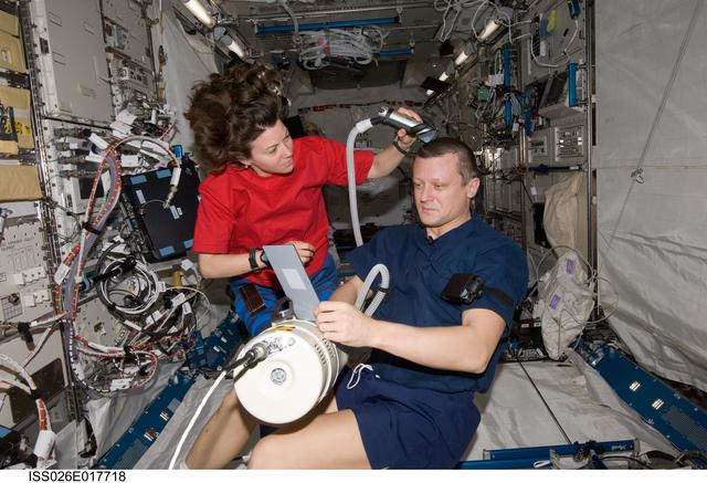 NASA image: Coleman cuts Kondratyev's hair in the JPM