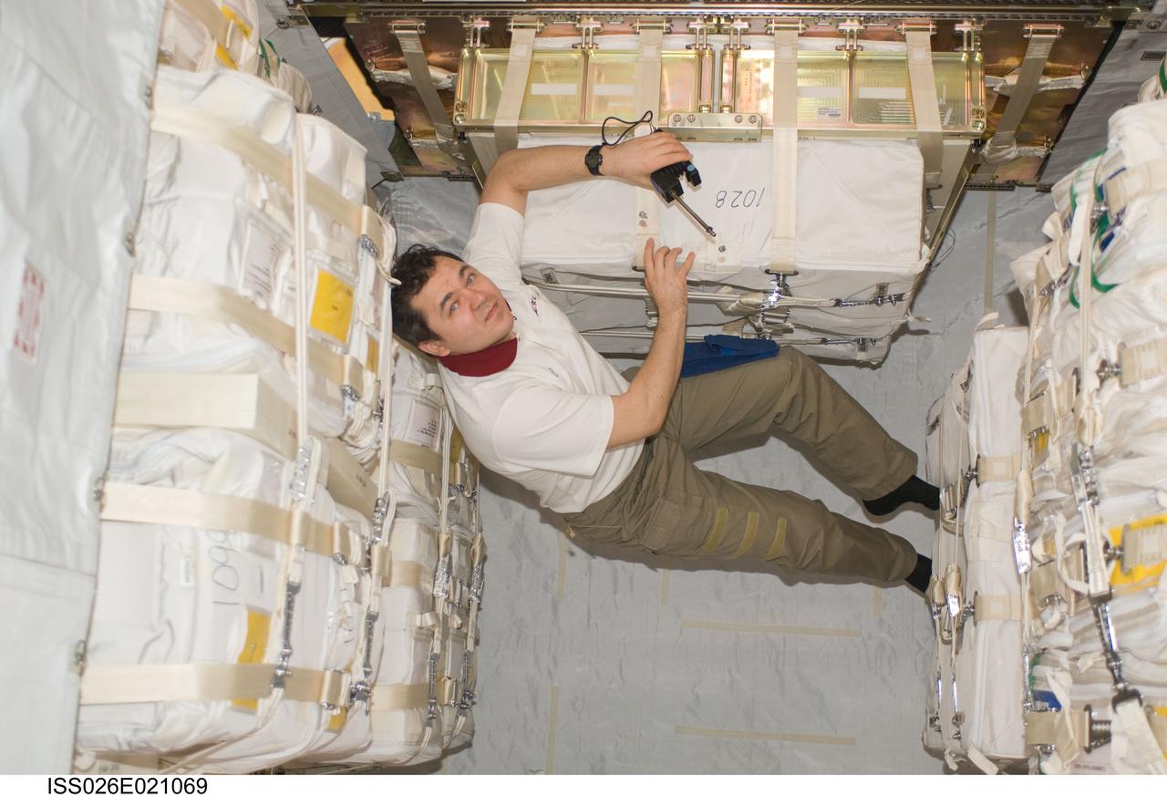 ISS026-E-021069 (27 Jan. 2011) --- Russian cosmonaut Oleg Skripochka, Expedition 26 flight engineer, works in the Japanese Kounotori2 H-II Transfer Vehicle (HTV2) docked to the Harmony node of the International Space Station.