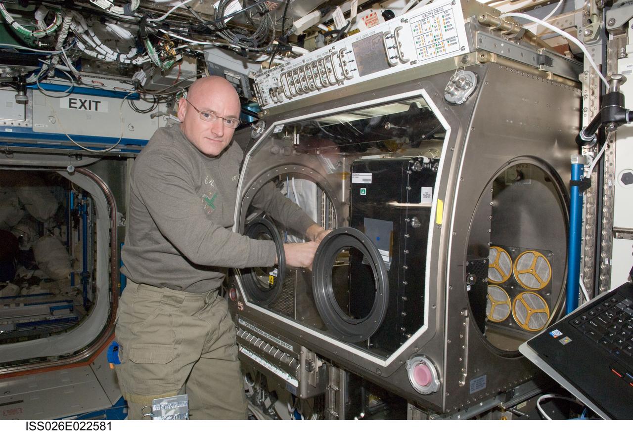 ISS026-E-022581 (27 Dec. 2010) --- NASA astronaut Scott Kelly, Expedition 26 commander, works with Capillary Channel Flow (CCF) experiment hardware in the Microgravity Science Glovebox (MSG) in the Destiny laboratory of the International Space Station. CCF is a versatile experiment for studying a critical variety of inertial-capillary dominated flows key to spacecraft systems that cannot be studied on the ground.