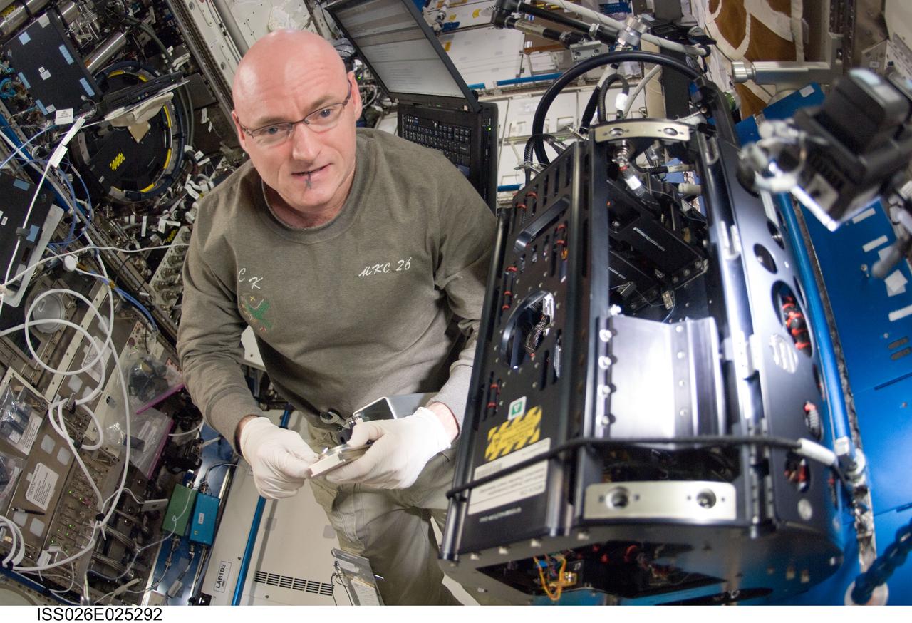 ISS026-E-025292 (9 Feb. 2011) --- NASA astronaut Scott Kelly, Expedition 26 commander, works on the Combustion Integrated Rack (CIR) Multi-user Drop Combustion Apparatus (MDCA) in the Destiny laboratory of the International Space Station.