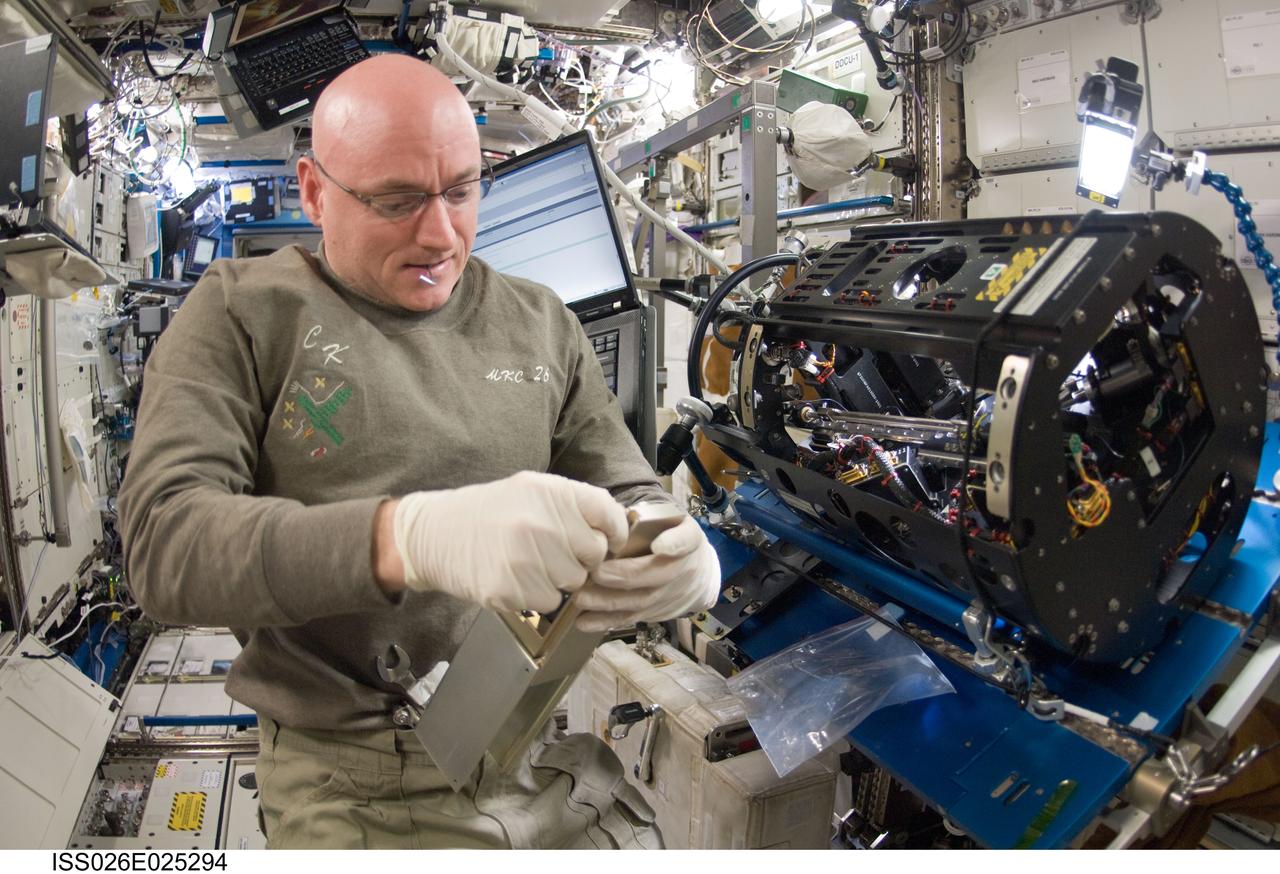 ISS026-E-025294 (9 Feb. 2011) --- NASA astronaut Scott Kelly, Expedition 26 commander, works on the Combustion Integrated Rack (CIR) Multi-user Drop Combustion Apparatus (MDCA) in the Destiny laboratory of the International Space Station.