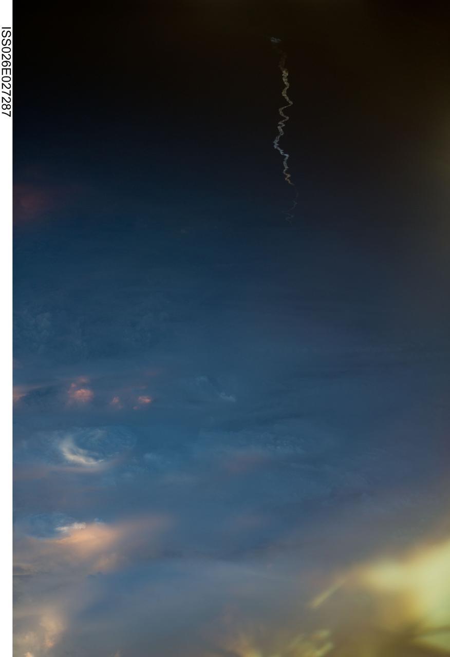 ISS026-E-027287 (16 Feb. 2011) --- The Expedition 26 crew member aboard the International Space Station who snapped this photograph of the Ariane 5 rocket (faint squiggly vertical form in the midst of darkness above the clouds), just after lift off from Europe’s Spaceport in Kourou, French Guiana, and the rest of the crew have a special interest in the occurrence. ESA’s second Automated Transfer Vehicle, Johannes Kepler, was just a short time earlier (21:50 GMT or 18:50 Kourou time on Feb. 16, 2011) launched toward its approaching low orbit destination and its eventual link-up with the ISS. The unmanned supply ship is planned to deliver critical supplies and reboost the space station during its almost four-month mission.