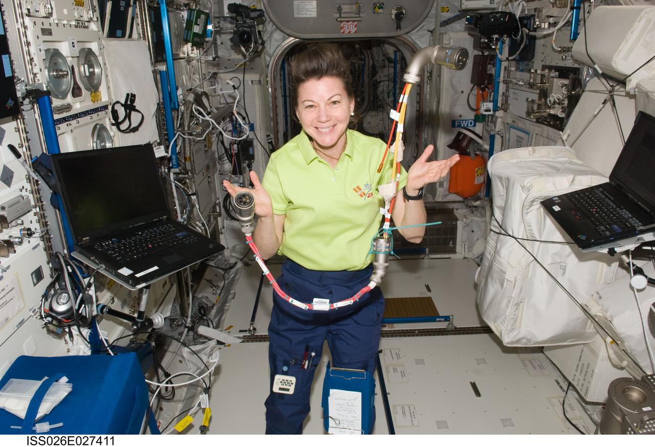 ISS026-E-027411 (16 Feb. 2011) --- NASA astronaut Catherine (Cady) Coleman, Expedition 26 flight engineer, is pictured with a W6005 power jumper in the Columbus laboratory of the International Space Station.