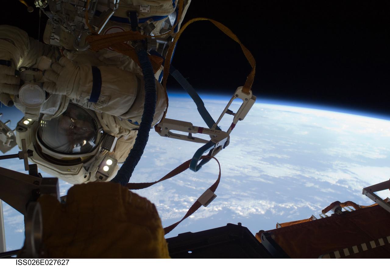 ISS026-E-027627 (16 Feb. 2011) --- Russian cosmonaut Oleg Skripochka, Expedition 26 flight engineer, wearing a Russian Orlan-MK spacesuit, participates in a session of extravehicular activity (EVA) focused on the installation of two scientific experiments outside the Zvezda Service Module of the International Space Station. During the four-hour, 51-minute spacewalk, Skripochka and Russian cosmonaut Dmitry Kondratyev (out of frame), flight engineer, installed a pair of earthquake and lightning sensing experiments and retrieved a pair of spacecraft material evaluation panels.