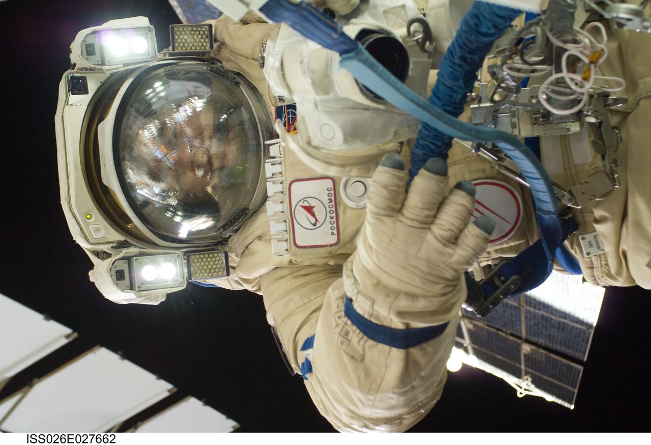 ISS026-E-027662 (16 Feb. 2011) --- Russian cosmonaut Oleg Skripochka, Expedition 26 flight engineer, wearing a Russian Orlan-MK spacesuit, participates in a session of extravehicular activity (EVA) focused on the installation of two scientific experiments outside the Zvezda Service Module of the International Space Station. During the four-hour, 51-minute spacewalk, Skripochka and Russian cosmonaut Dmitry Kondratyev (out of frame), flight engineer, installed a pair of earthquake and lightning sensing experiments and retrieved a pair of spacecraft material evaluation panels.