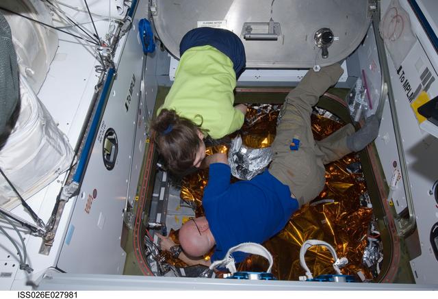 NASA image: Kelly and Coleman prepare for HTV2 relocation